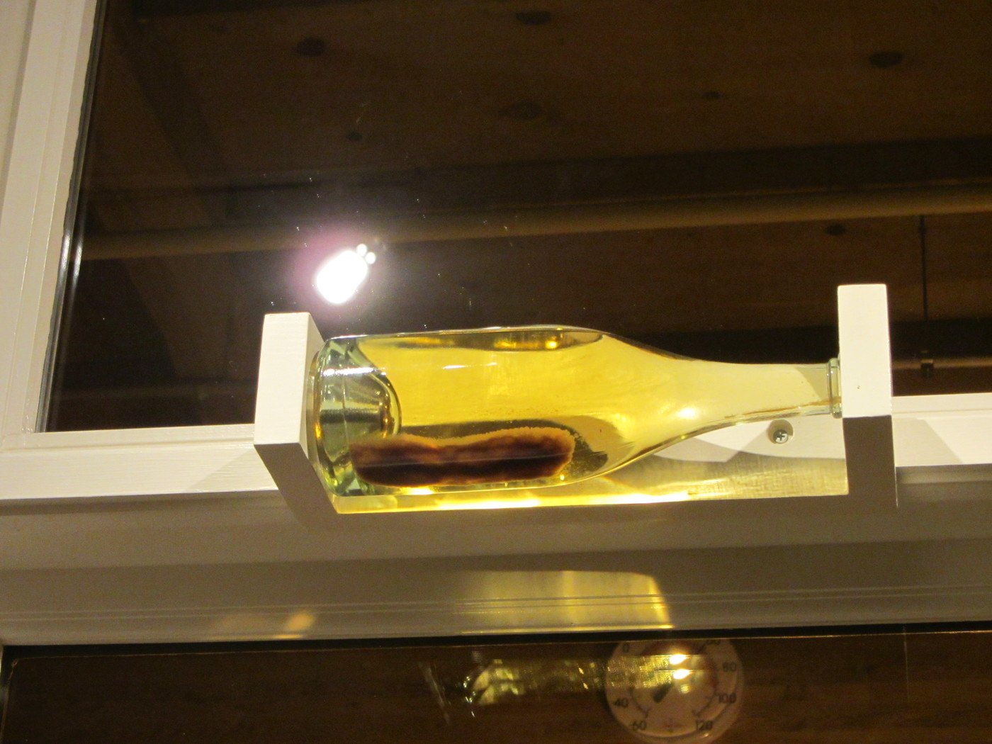 Lees sediment in a sparkling wine bottle