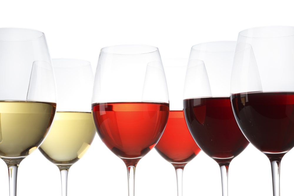 Wine glasses with wine of different colours and intensity